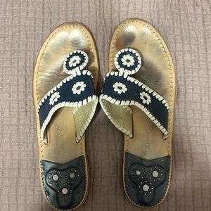 Jack Rogers.
Navy, trimmed in white size 9.